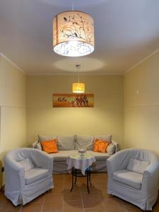 a living room with a couch and two chairs and a table at B&B Al San Francesco in Castel di Sangro