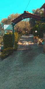 a parking lot with a picnic table and a pavilion at Violetta Studios & Apartments in Mil&iacute;na