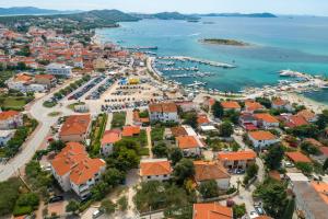 an aerial view of a town with a harbor at Apartmani Vilma Pakoštane in Pakoštane