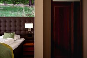 Postel nebo postele na pokoji v ubytování Boshotel - Vlodrop, Roermond