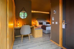 En eller flere senger på et rom på Quinta do Pedregal Hotel & Spa