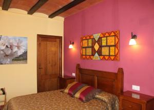 Säng eller sängar i ett rum på El Corral de Valero