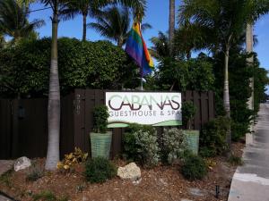 a sign for the entrance to acadias subticulture and spa at The Cabanas Guesthouse & Spa - Gay Resort catering to Gay Men in Fort Lauderdale