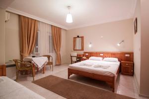 Postel nebo postele na pokoji v ubytování Metin Hotel