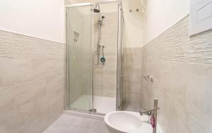 a bathroom with a shower and a sink at La Casetta sul Mare in Isola delle Femmine