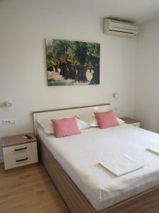 Postel nebo postele na pokoji v ubytování Guesthouse Dominović