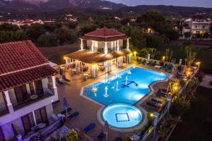 an aerial view of a house with a swimming pool at MAKIS STUDIOS in Roda