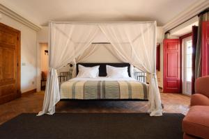 En eller flere senge i et værelse på A Casa do Governador