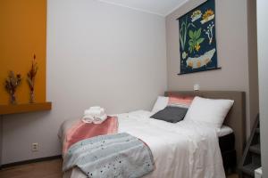 Postel nebo postele na pokoji v ubytování HOLT Hotel