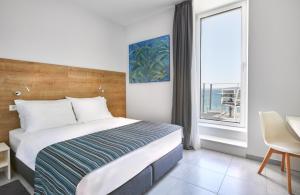 Postel nebo postele na pokoji v ubytování Hotel Štacija