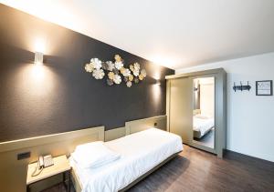Postelja oz. postelje v sobi nastanitve Hotel Cortina