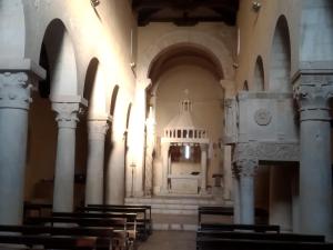 an empty church with a bunch of pews in it at Sognando Bominaco - Dimora il Milord in Bominaco