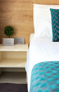 Posteľ alebo postele v izbe v ubytovaní Hotel Štacija