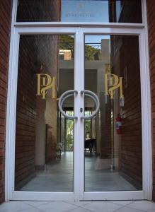 a front door of a building with a ring in the window at Prime Hotel in Durban