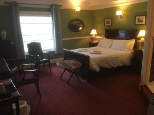 Ein Bett oder Betten in einem Zimmer der Unterkunft The Wynnstay