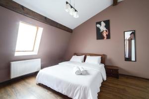 Postel nebo postele na pokoji v ubytování Aparthotel Na Mytniy