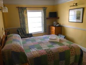Ein Bett oder Betten in einem Zimmer der Unterkunft The Wynnstay