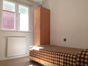 En eller flere senge i et værelse på VUT Santa Marta