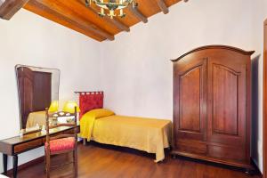 A bed or beds in a room at Casa Vacanze 4 Pileri