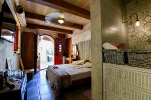 Rúm í herbergi á Charming B&B Dar Ta Zeppi