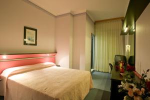 Postel nebo postele na pokoji v ubytování Hotel Ida