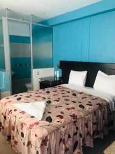 En eller flere senge i et værelse på Hotel Casa de Turistas