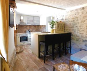 Kuchyň nebo kuchyňský kout v ubytování Apartments Villa Serventi