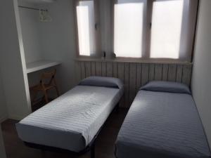 Postel nebo postele na pokoji v ubytování Camping Ezcaba
