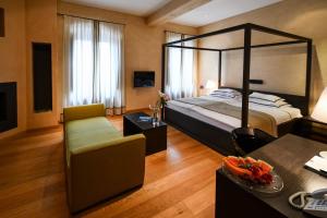 Posteľ alebo postele v izbe v ubytovaní Heritage Hotel Kukuriku