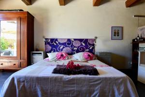 Rúm í herbergi á Charming B&B Dar Ta Zeppi