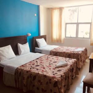 Postel nebo postele na pokoji v ubytování Hotel Casa de Turistas + 38 fotografií