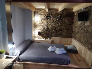 A bed or beds in a room at Albergue Atrio