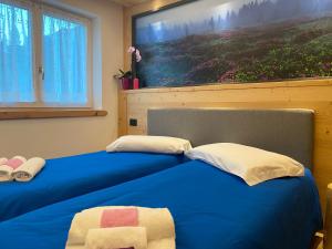 Postel nebo postele na pokoji v ubytování B&B DeBy & E-Bike Rental
