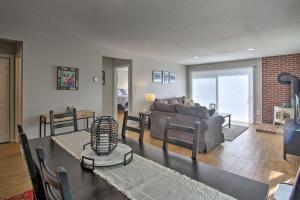 a living room with a couch and a table at Family-Friendly Condo with Mtn Views, Community Pool in Intervale
