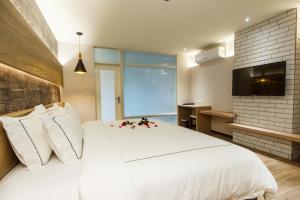 大埔硫磺溫泉商務旅館房間的床