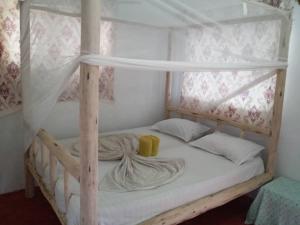 Postel nebo postele na pokoji v ubytování New Iddi Villa