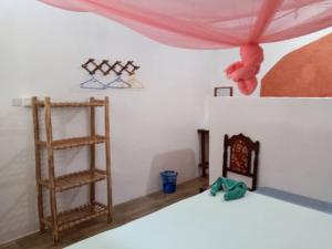 Postel nebo postele na pokoji v ubytování New Iddi Villa