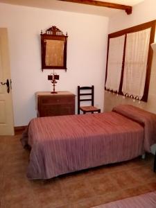 Łóżko lub łóżka w pokoju w obiekcie La pension del Parador