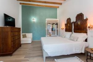 En eller flere senge i et værelse på Villa Agrumeto