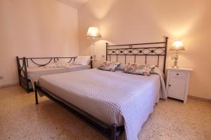 a bedroom with two beds with pillows on them at CORE MIO in Assisi