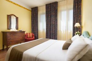 Postel nebo postele na pokoji v ubytování Hotel San Gregorio