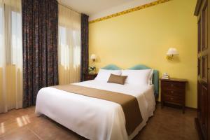 Postel nebo postele na pokoji v ubytování Hotel San Gregorio
