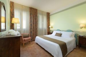 Postel nebo postele na pokoji v ubytování Hotel San Gregorio
