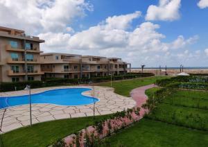 a view of a resort with a swimming pool at Nice view in ‘Izbat Abū Sulayman