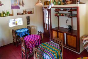 a dining room with two chairs and a table at Azul Humahuaca Hostal in Humahuaca