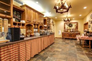 a large kitchen with a counter and a restaurant at Bavarian Lodge in Leavenworth