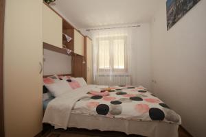 Ein Bett oder Betten in einem Zimmer der Unterkunft Apartman Lucija & Luka