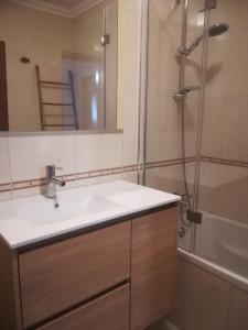 a bathroom with a sink and a shower at Camarção Violante in Foz do Arelho +24 photos