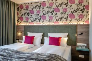Postel nebo postele na pokoji v ubytování Boutique Hotel Erb München Parsdorf