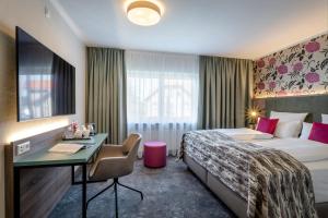 Postel nebo postele na pokoji v ubytování Boutique Hotel Erb München Parsdorf
